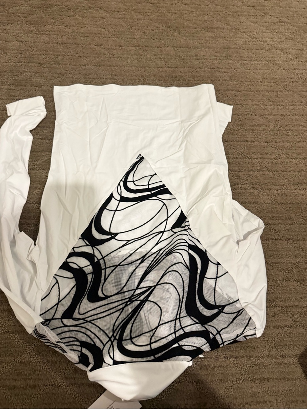 Kismet riding White Top with Black Swirl Panel